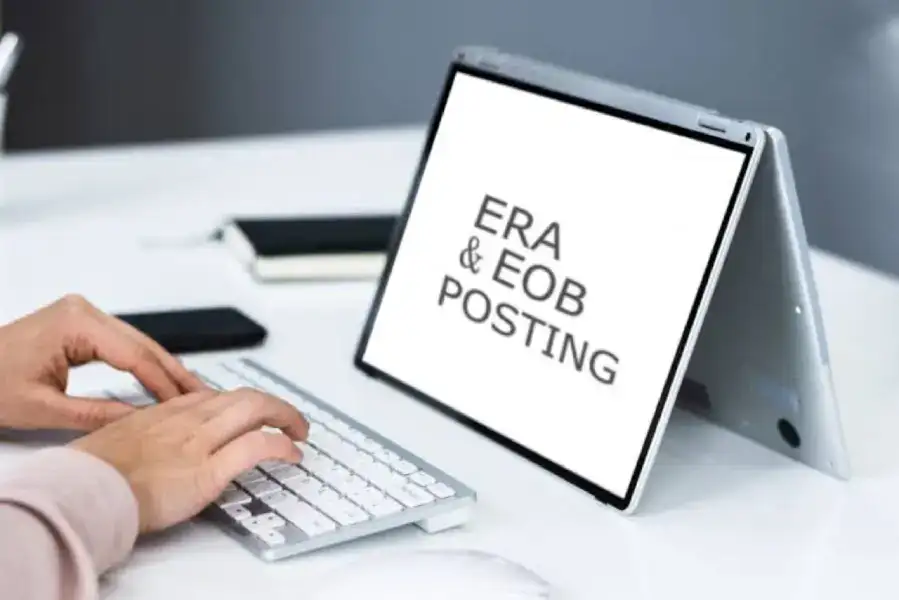 ERP & EOB Posting digital workflow displayed on a tablet screen with a person's hands typing on a wireless keyboard. Modern office setup for financial and insurance processing.