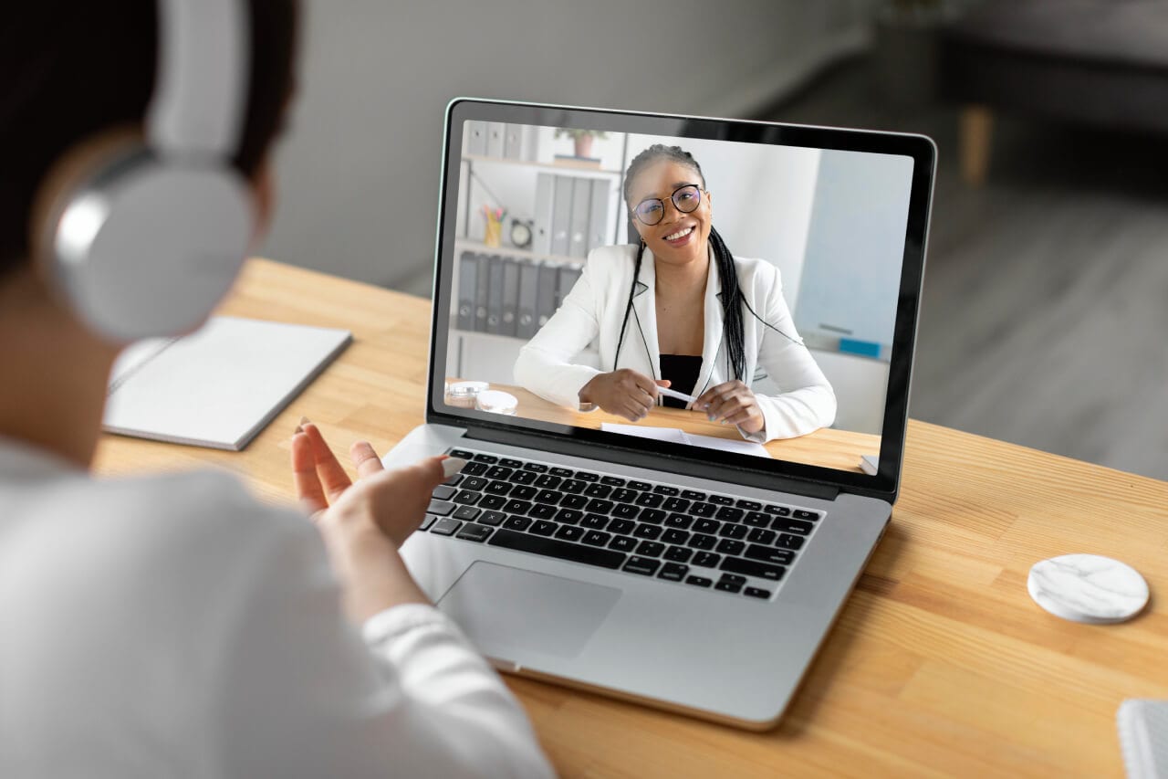 Remote healthcare consultation via telehealth with a doctor on laptop screen, emphasizing telemedicine, virtual doctor visits, digital healthcare, and telehealth services.